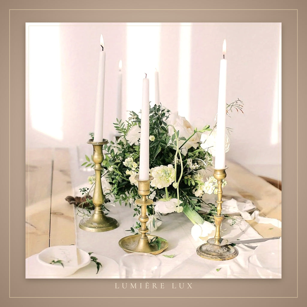 Tall white taper candles on an elegant table