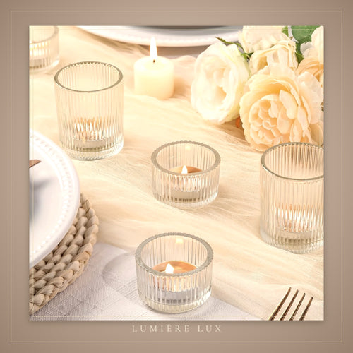 Clear votive holders on a wedding table